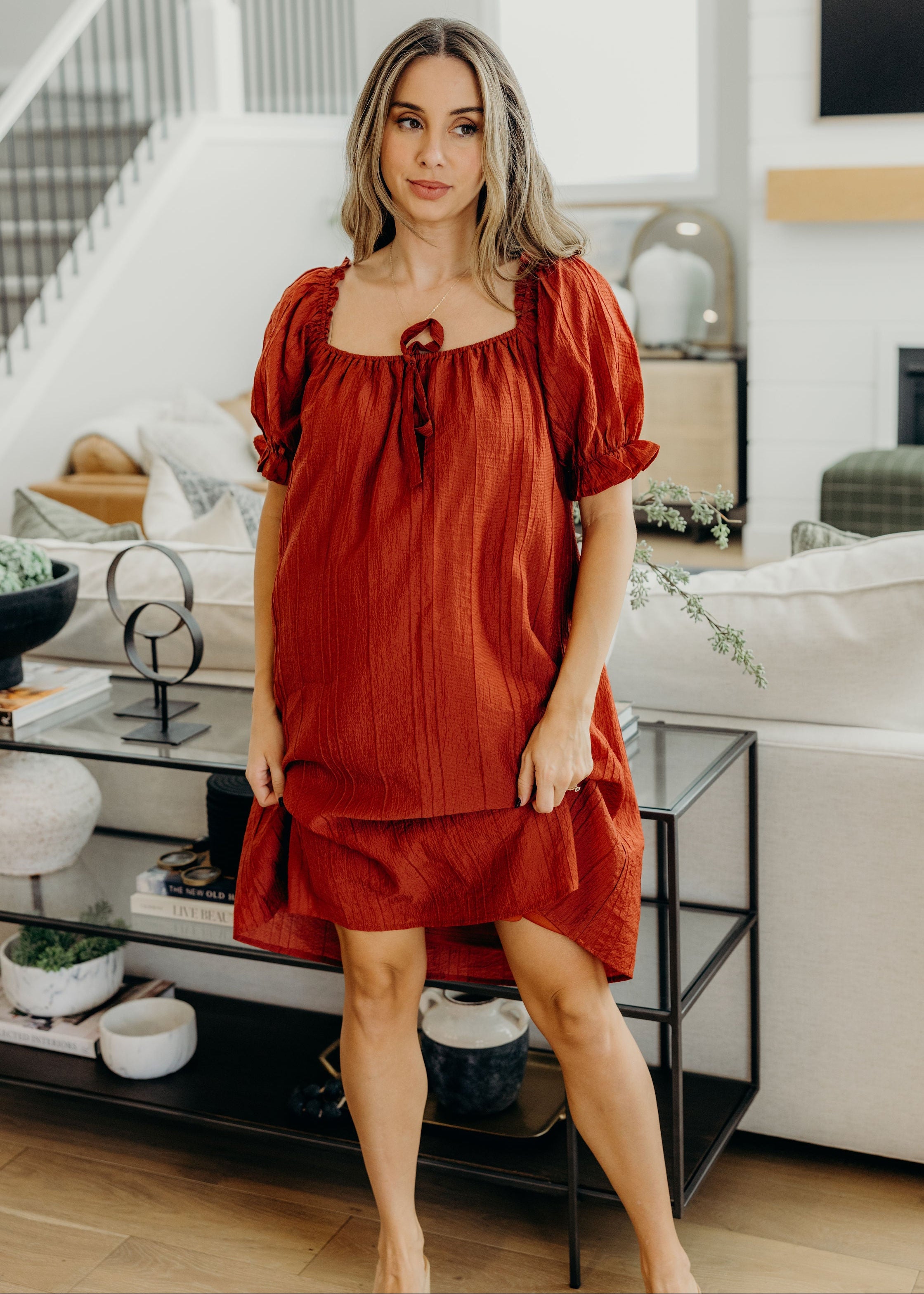 Knee length dress with square neckline and short sleeves.