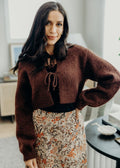 Brown crop sweater with ribbed hem and cuffs with 2 tie closures.